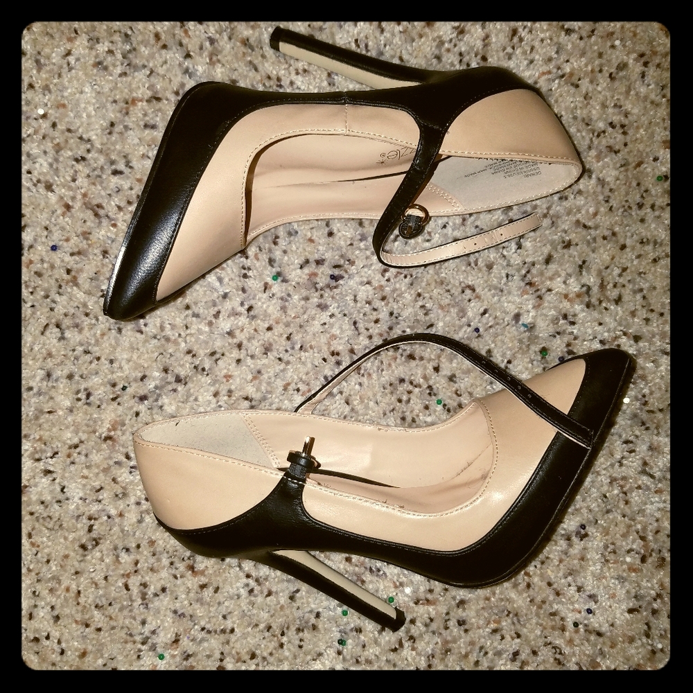 Cream and black pumps